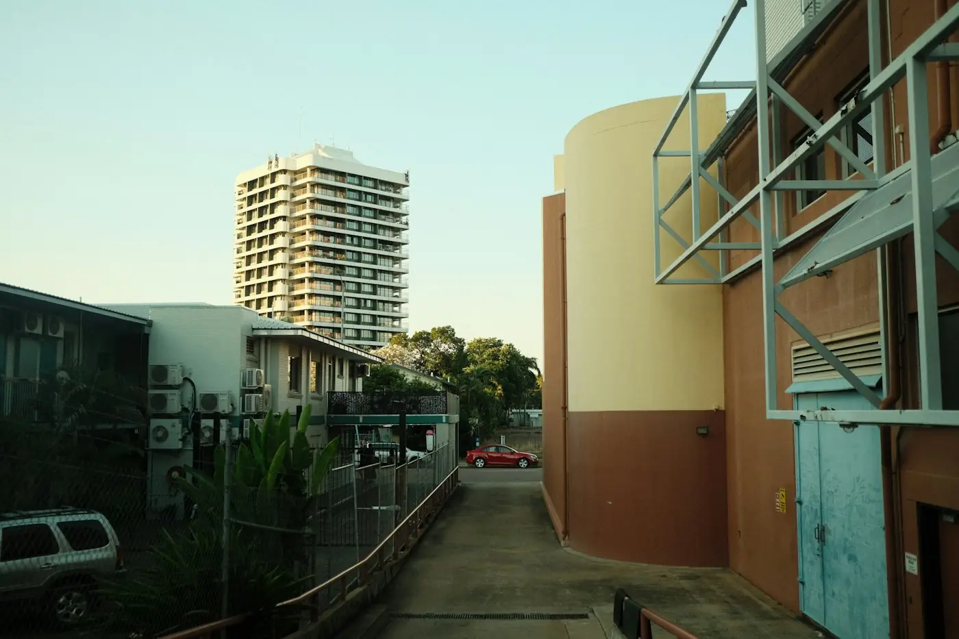 Darwin street lined with tropical buildings and palm trees